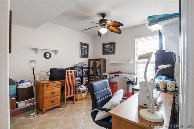 tiled office space featuring ceiling fan