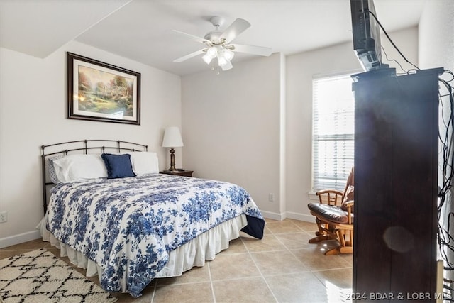 bedroom featuring light tile flooring and ceiling fan