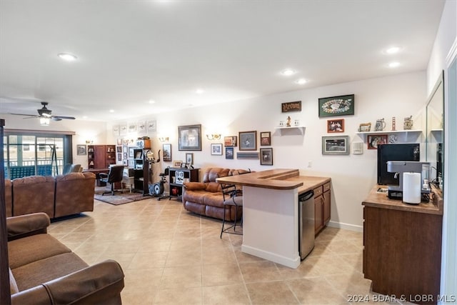 tiled living room with ceiling fan