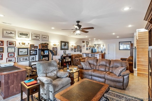 tiled living room with ceiling fan