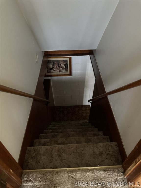 staircase with tile floors