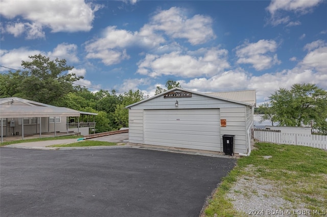 garage featuring a carport