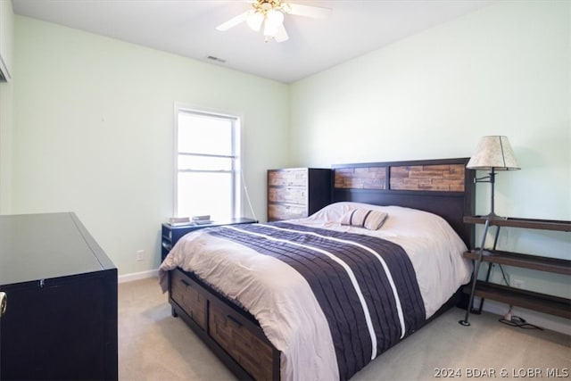 carpeted bedroom with ceiling fan