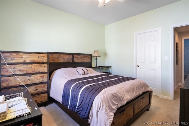 bedroom with ceiling fan and light colored carpet