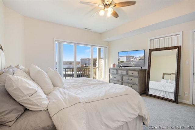 carpeted bedroom featuring access to outside and ceiling fan