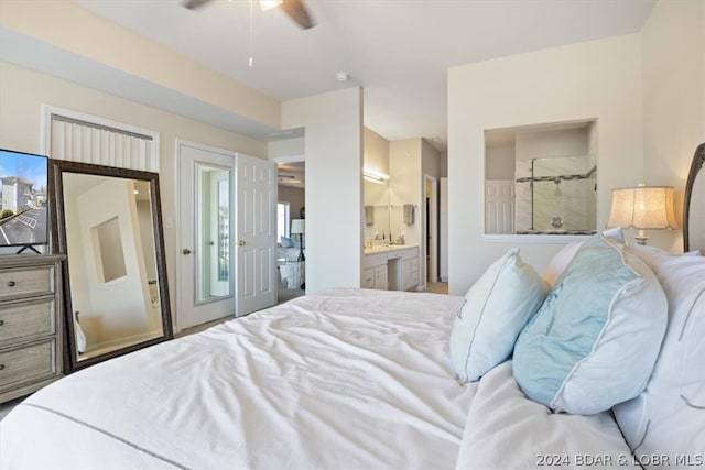 bedroom featuring ensuite bath and ceiling fan