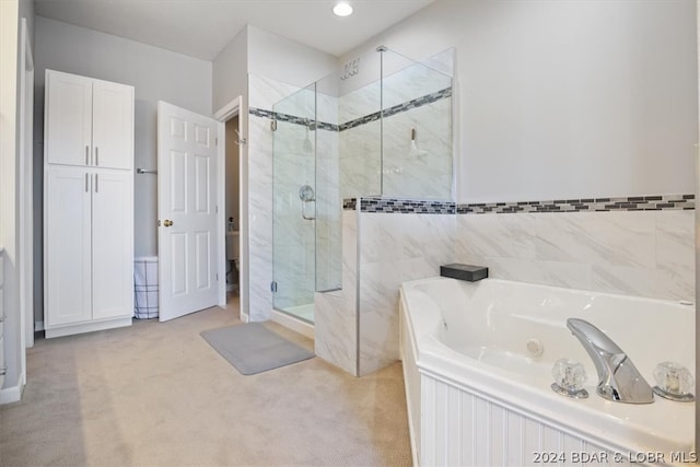 bathroom with separate shower and tub