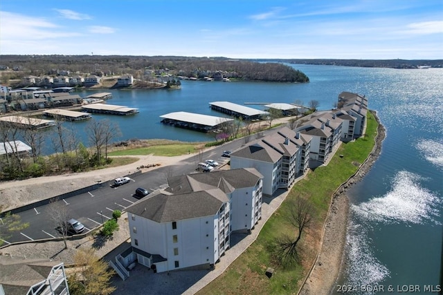 birds eye view of property with a water view