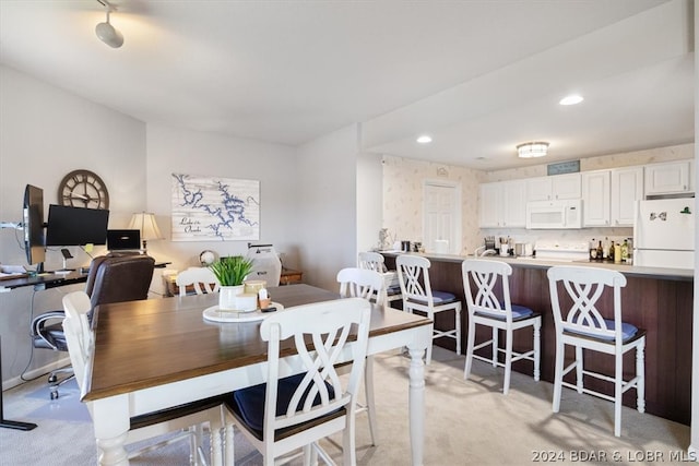 view of carpeted dining area