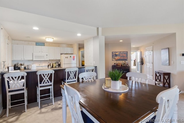 dining area with light carpet