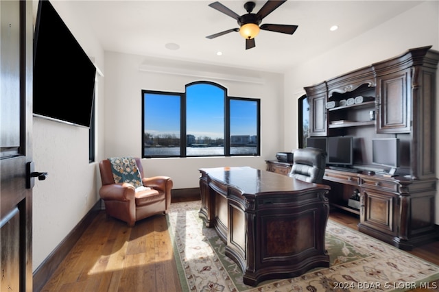 office featuring hardwood / wood-style floors and ceiling fan