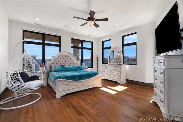 bedroom featuring dark hardwood / wood-style flooring and ceiling fan