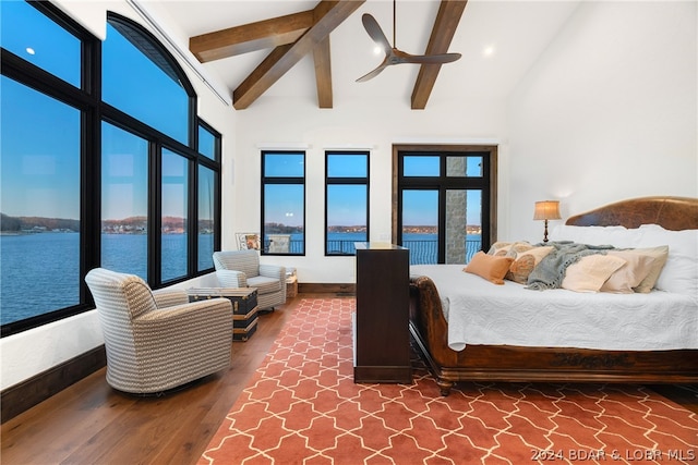 bedroom with a water view, high vaulted ceiling, dark wood-type flooring, and beamed ceiling