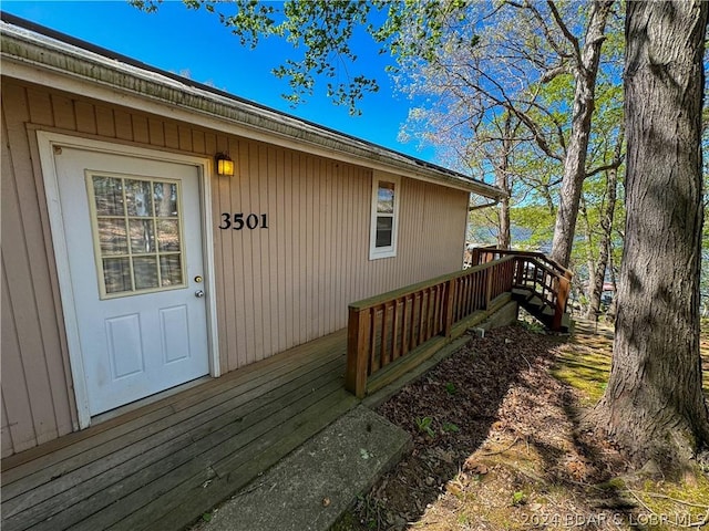 doorway to property with a deck