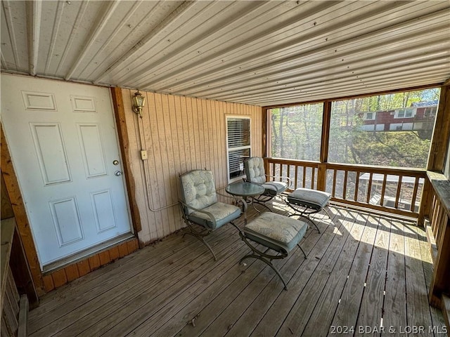 sunroom featuring wood ceiling