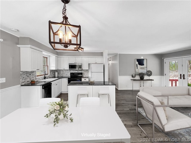 kitchen featuring electric range, dark hardwood / wood-style floors, white refrigerator, and white cabinetry