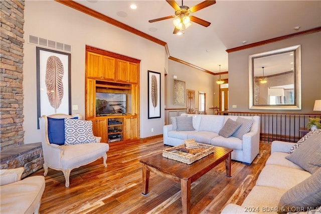 living room featuring hardwood / wood-style flooring, ceiling fan, and crown molding