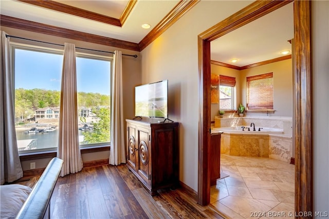 doorway to outside with ornamental molding, a water view, and dark wood-type flooring