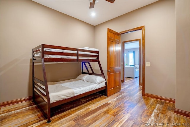 bedroom featuring wood-type flooring and ceiling fan