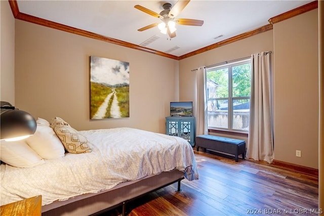 bedroom with hardwood / wood-style flooring, ceiling fan, and ornamental molding