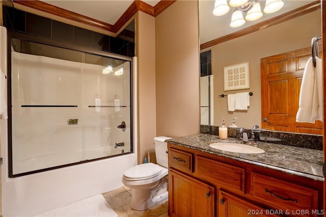 full bathroom featuring tile patterned floors, toilet, ornamental molding, vanity, and enclosed tub / shower combo