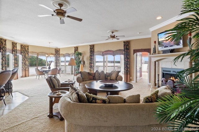 carpeted living room with crown molding, ceiling fan, and a textured ceiling