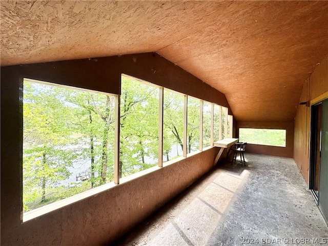 unfurnished sunroom with lofted ceiling