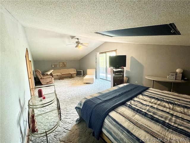 bedroom with access to outside, vaulted ceiling, ceiling fan, a textured ceiling, and carpet flooring