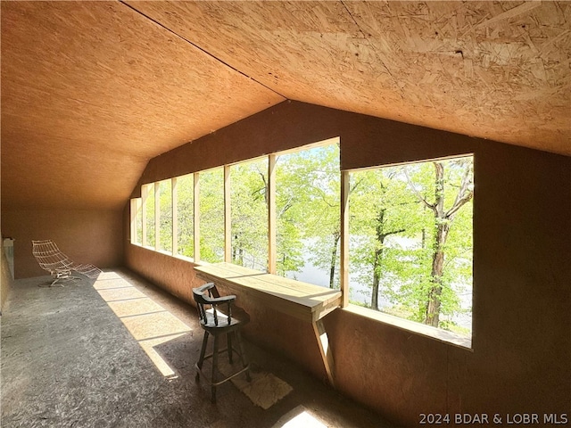 unfurnished sunroom with lofted ceiling