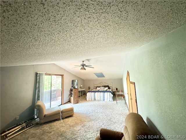 unfurnished bedroom featuring carpet, access to exterior, vaulted ceiling, and a textured ceiling