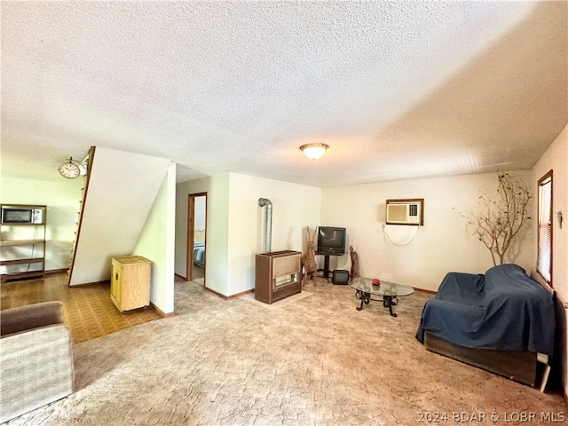 living area with light carpet, a textured ceiling, and an AC wall unit