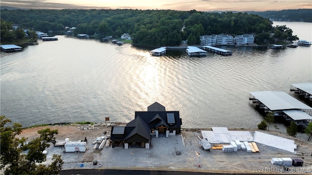 aerial view at dusk with a water view