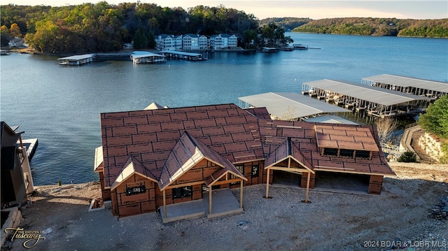 aerial view at dusk with a water view