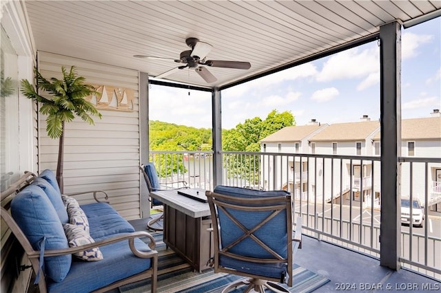 sunroom / solarium with ceiling fan and wood ceiling