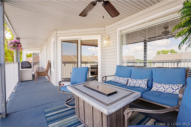 view of patio / terrace with ceiling fan and an outdoor living space