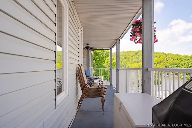 balcony featuring a view of trees