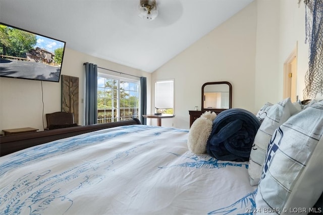 bedroom featuring high vaulted ceiling