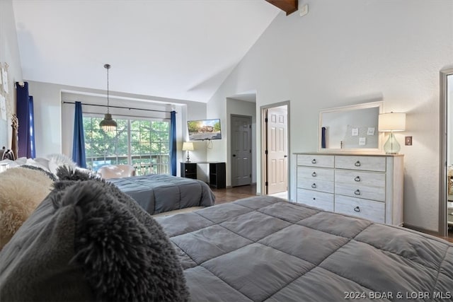 bedroom with high vaulted ceiling, hardwood / wood-style floors, and beam ceiling