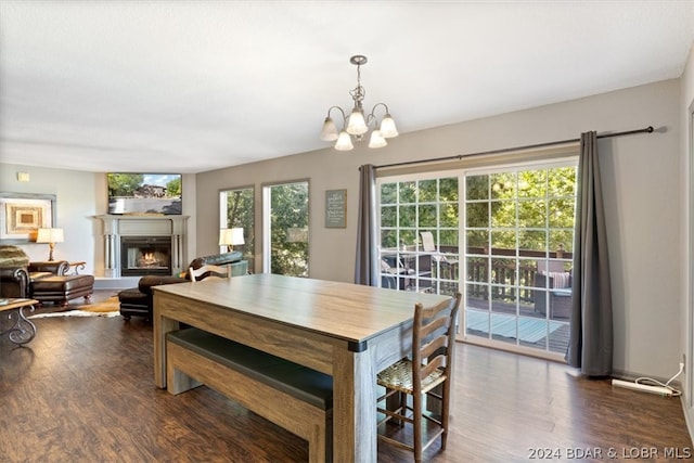 dining space featuring a chandelier and dark hardwood / wood-style floors