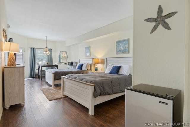 bedroom featuring ceiling fan and dark hardwood / wood-style floors