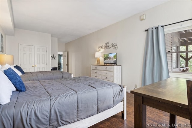 bedroom featuring a closet and dark hardwood / wood-style floors