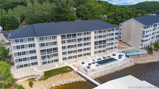 drone / aerial view featuring a water view