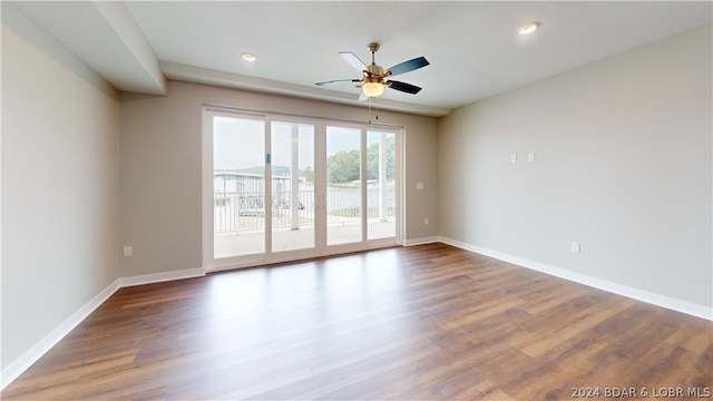 unfurnished room with ceiling fan and hardwood / wood-style floors