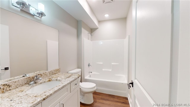 full bathroom with shower / bath combination, toilet, vanity, and wood-type flooring