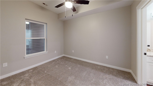 carpeted empty room with ceiling fan