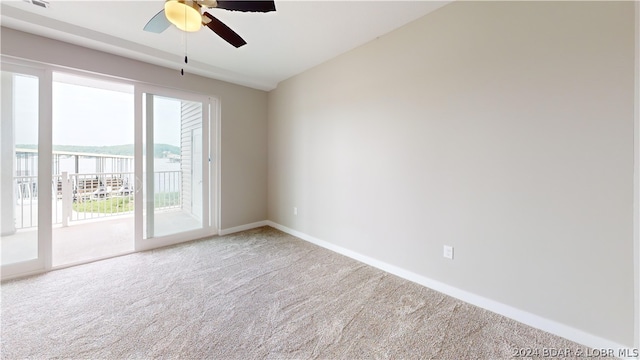 unfurnished room featuring french doors, carpet flooring, and ceiling fan