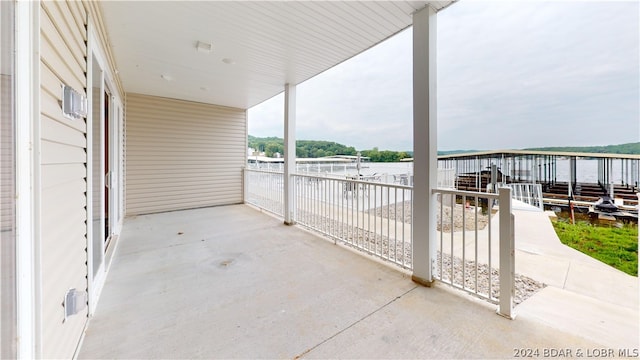 view of patio featuring a water view