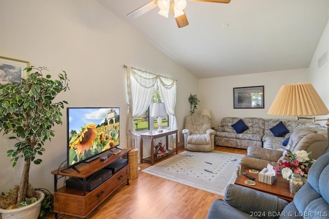 living room featuring high vaulted ceiling, hardwood / wood-style flooring, and ceiling fan