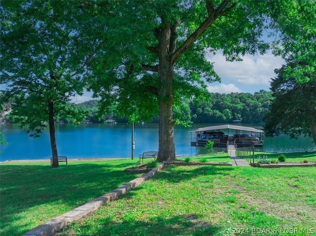 exterior space featuring a water view and a dock