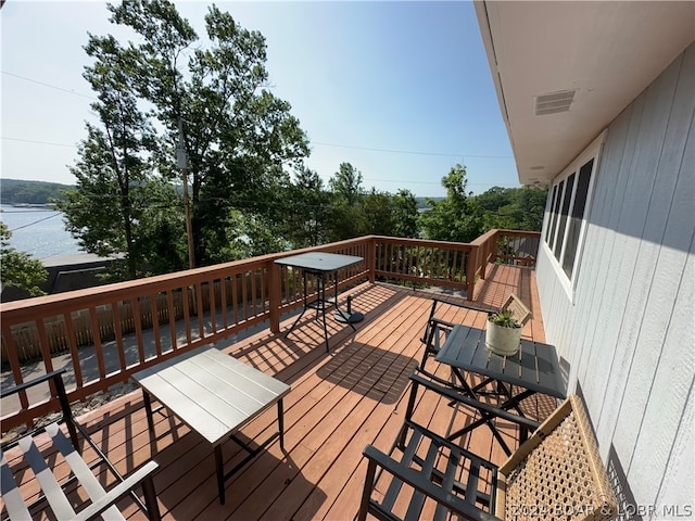 deck featuring a water view